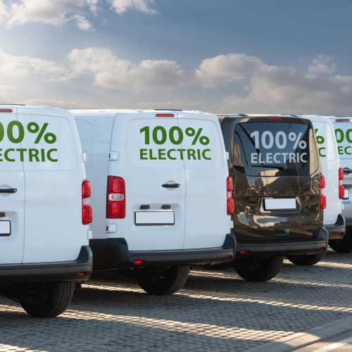 Electric,Vans,Parked,In,A,Row
